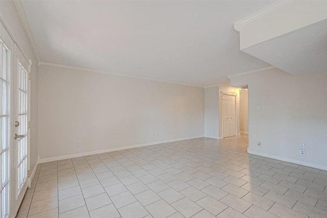 spare room with french doors, baseboards, and ornamental molding