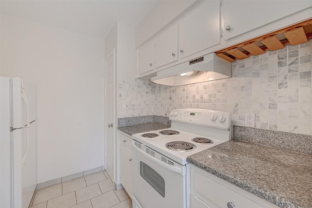 kitchen with under cabinet range hood, decorative backsplash, white appliances, and white cabinetry