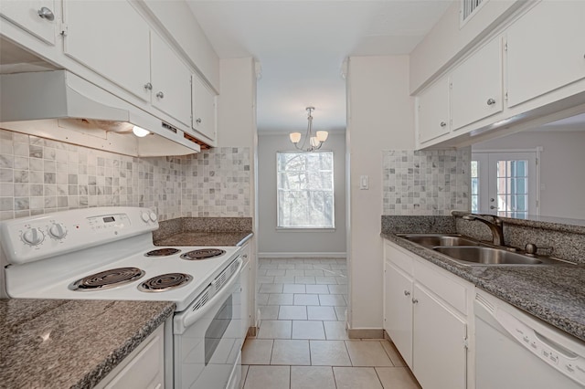 kitchen with white appliances, light tile patterned flooring, a sink, under cabinet range hood, and white cabinetry