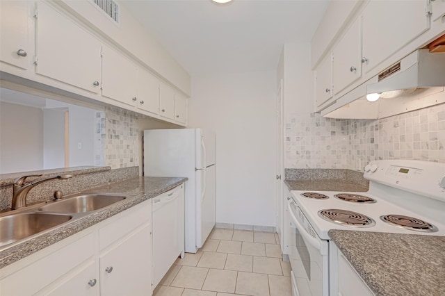 kitchen featuring a sink, white appliances, white cabinets, light tile patterned floors, and decorative backsplash