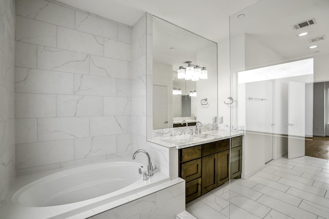 full bathroom with visible vents, recessed lighting, vanity, and a garden tub