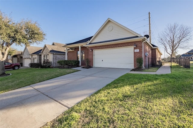 single story home with a front yard, fence, driveway, a garage, and brick siding