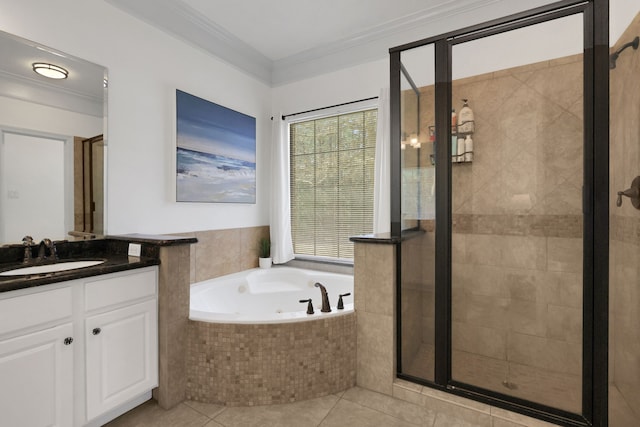 bathroom with vanity, a tub with jets, a stall shower, ornamental molding, and tile patterned flooring