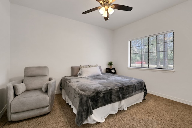 bedroom featuring carpet flooring, a ceiling fan, and baseboards