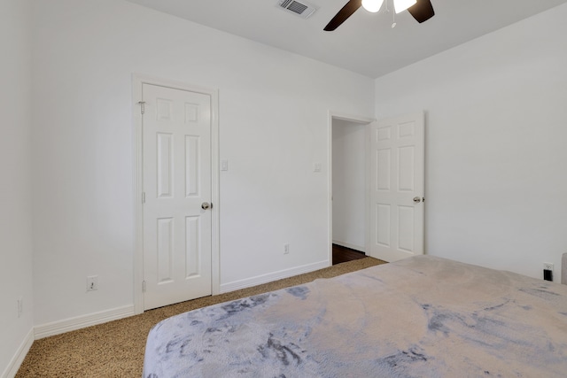 bedroom with visible vents, baseboards, a ceiling fan, and carpet flooring