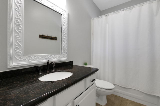 full bathroom with tile patterned floors, shower / tub combo with curtain, toilet, and vanity