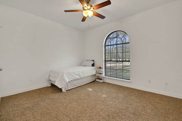 bedroom featuring carpet flooring, a ceiling fan, and baseboards