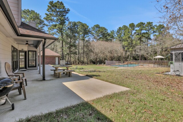 view of yard featuring fence, a patio area, and a fenced in pool