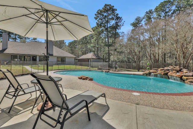 view of swimming pool with a fenced in pool, a patio area, and fence