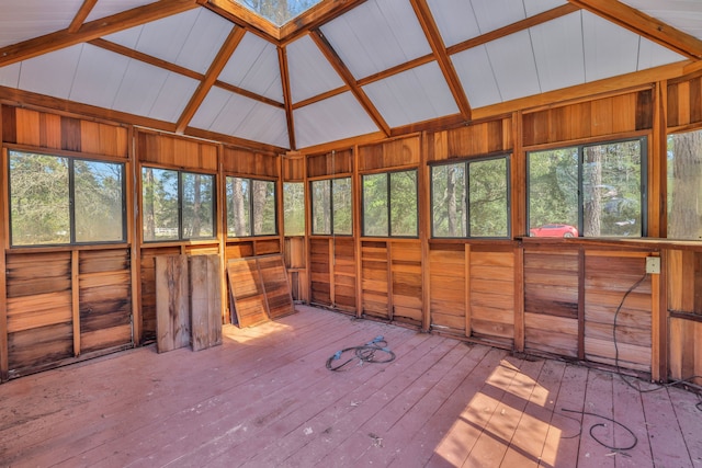 unfurnished sunroom featuring lofted ceiling