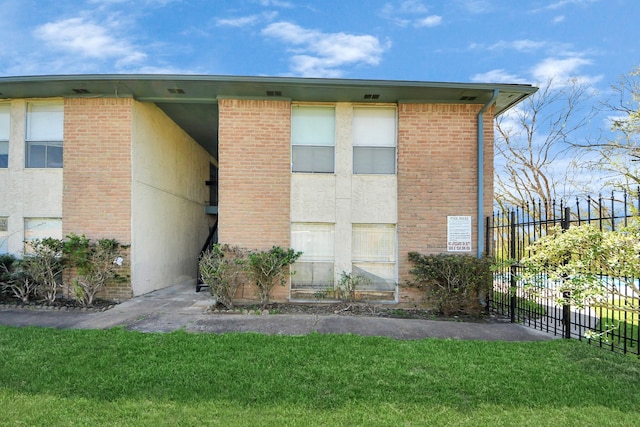 view of building exterior featuring fence