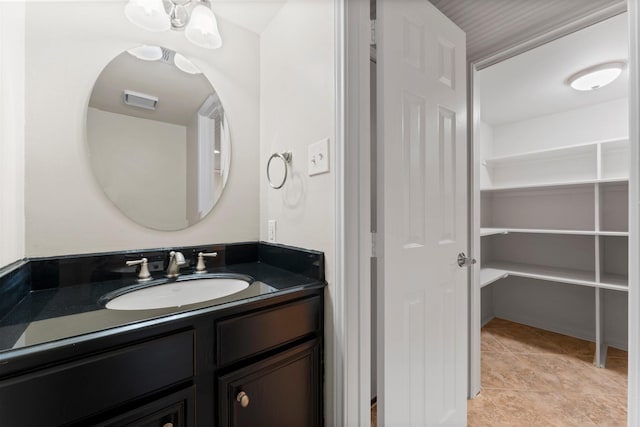 bathroom with vanity and tile patterned floors