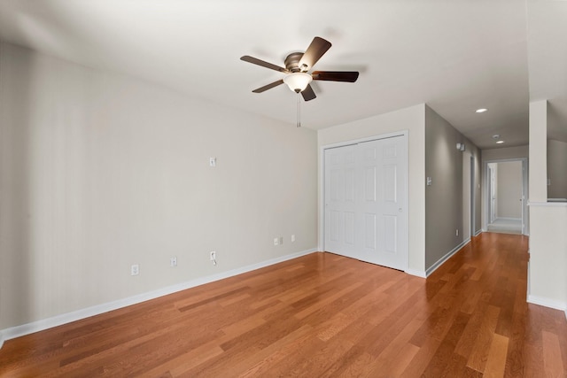 unfurnished room with recessed lighting, ceiling fan, baseboards, and wood finished floors