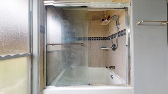 full bath with shower / bath combination with glass door