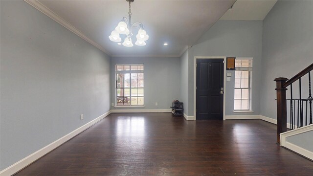 entrance foyer featuring stairway, wood finished floors, baseboards, and a wealth of natural light