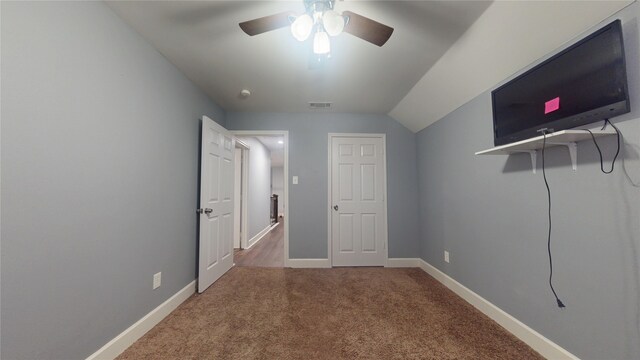 unfurnished bedroom featuring a ceiling fan, baseboards, and carpet floors