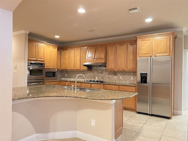 kitchen with visible vents, dark stone countertops, appliances with stainless steel finishes, and a sink