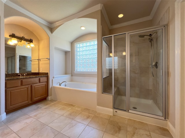 bathroom with a stall shower, ornamental molding, vanity, and a bath