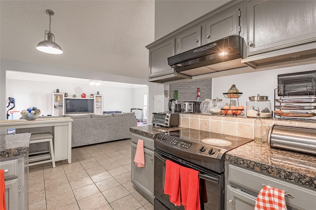 kitchen featuring gray cabinetry, black electric range, under cabinet range hood, a textured ceiling, and tile counters