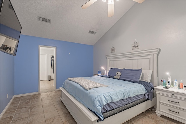 bedroom with visible vents, baseboards, ceiling fan, vaulted ceiling, and a textured ceiling