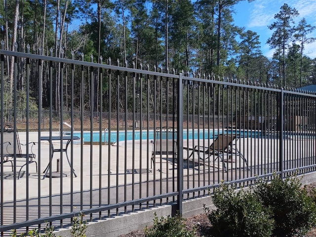 pool featuring fence