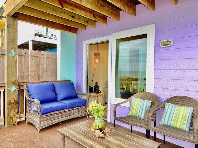 view of patio featuring fence and an outdoor hangout area