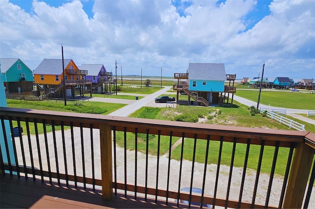 wooden deck with a yard and fence