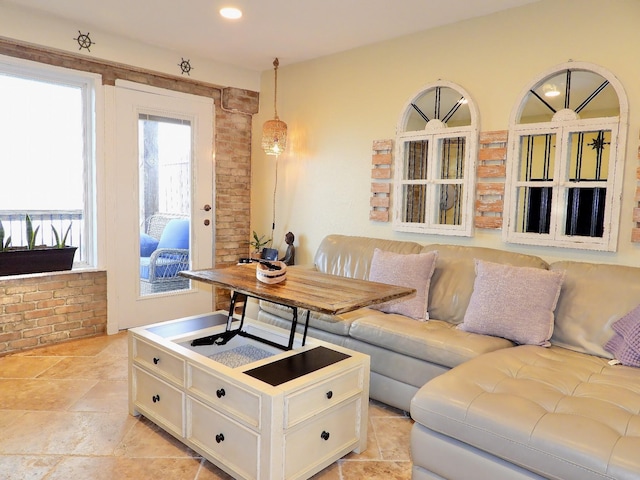 living area featuring recessed lighting and stone finish flooring