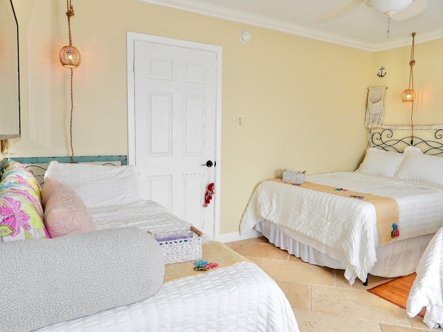 bedroom with a ceiling fan, baseboards, and ornamental molding