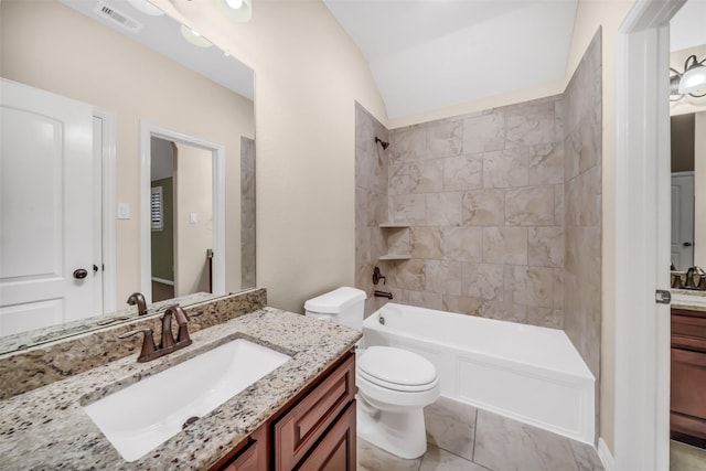 full bath with vanity, visible vents, lofted ceiling, shower / tub combination, and toilet