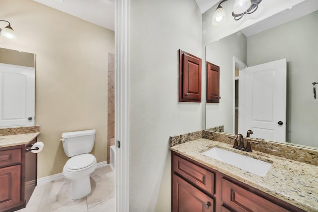 full bath with vanity, baseboards, tile patterned flooring, shower / tub combination, and toilet