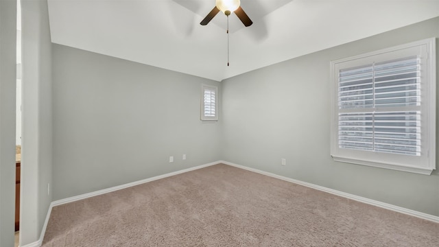 spare room featuring a ceiling fan, baseboards, and carpet floors