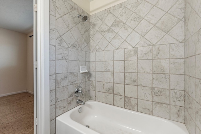 bathroom with baseboards and  shower combination