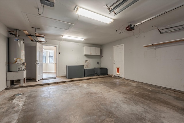 garage featuring gas water heater and a garage door opener