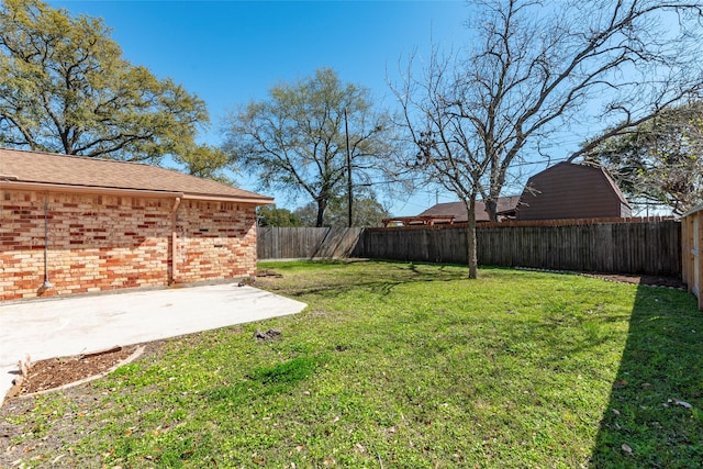 view of yard with a fenced backyard and a patio