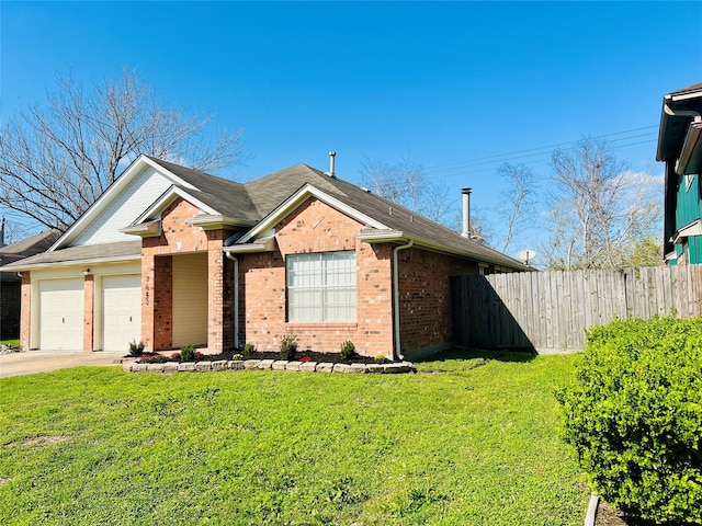 view of front of property with brick siding, a front lawn, fence, concrete driveway, and a garage