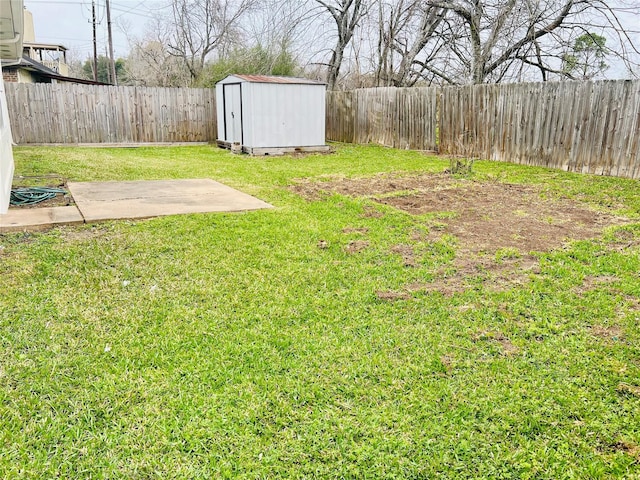 view of yard featuring an outdoor structure, a storage unit, a fenced backyard, and a patio