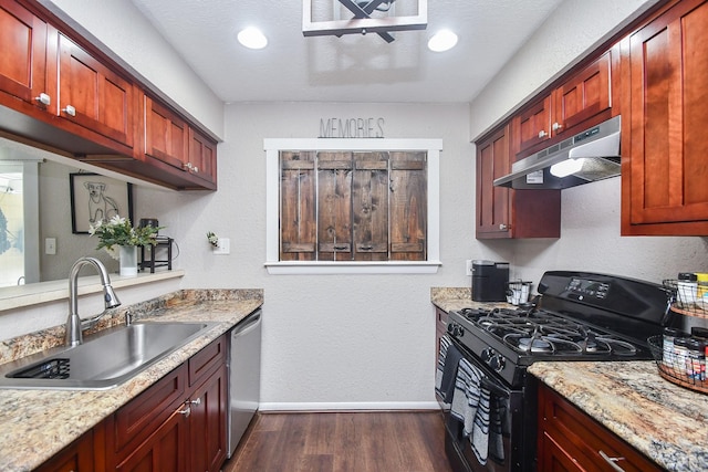 kitchen with dark wood-style floors, a sink, black gas range, under cabinet range hood, and dishwasher