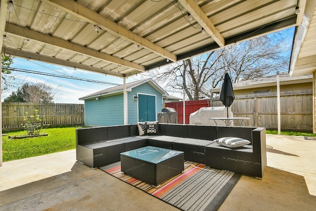 view of patio / terrace featuring a fenced backyard, an outdoor hangout area, and an outdoor structure