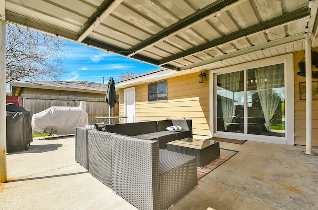 view of patio / terrace featuring grilling area, an outdoor hangout area, and fence