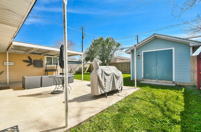 view of yard featuring a patio, an outdoor structure, a fenced backyard, and a shed