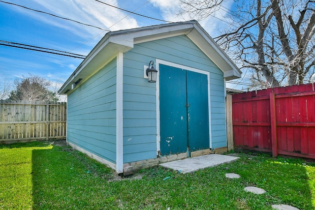 view of shed with a fenced backyard