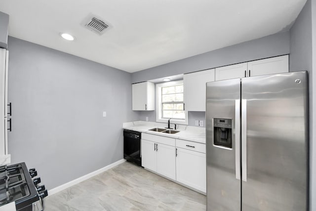 kitchen with visible vents, a sink, stove, stainless steel refrigerator with ice dispenser, and dishwasher