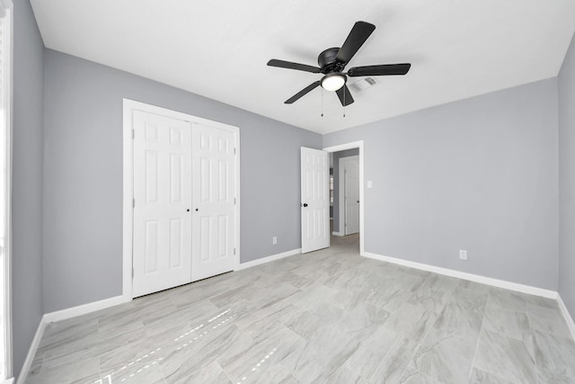 unfurnished bedroom featuring a closet, baseboards, and ceiling fan