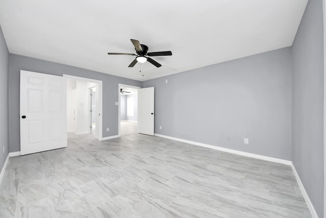 unfurnished bedroom featuring baseboards and ceiling fan