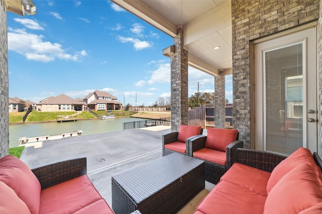 view of patio / terrace with a water view and an outdoor hangout area