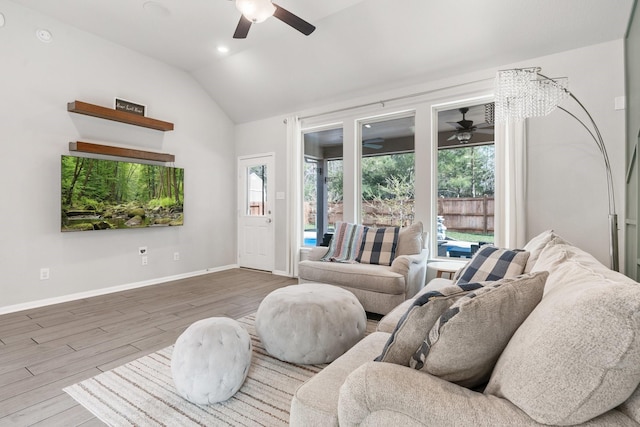 living room with baseboards, vaulted ceiling, recessed lighting, wood finished floors, and a ceiling fan