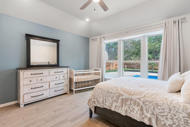 bedroom with access to exterior, ceiling fan, baseboards, vaulted ceiling, and light wood-style floors