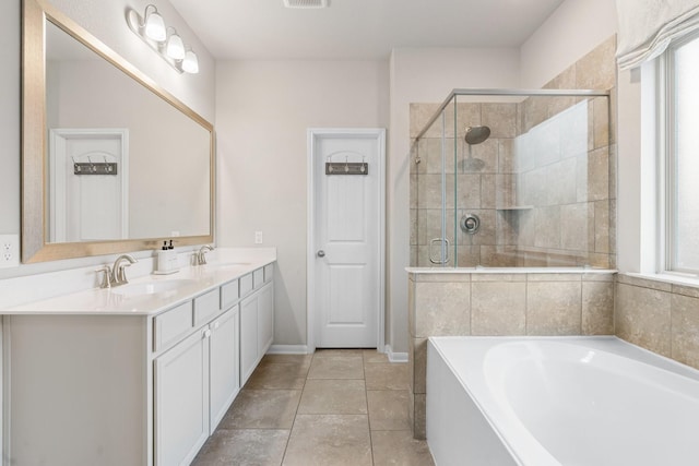 full bath with visible vents, a shower stall, double vanity, a bath, and a sink