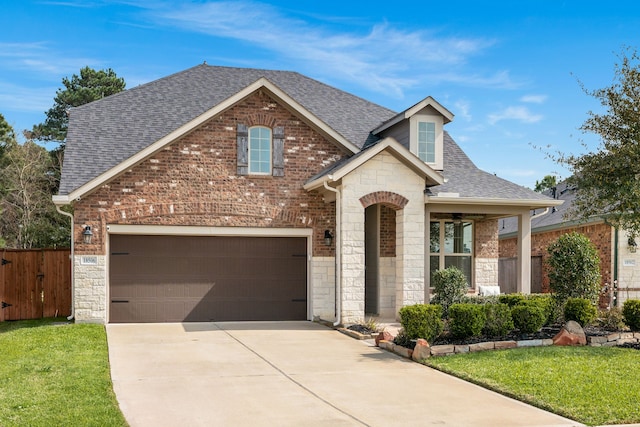 view of front of property featuring fence, a shingled roof, concrete driveway, a garage, and stone siding